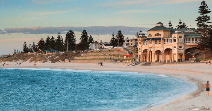 The waves gently roll in at the Cottesloe foreshore in front of the famous Perth destination, the Indiana tea rooms